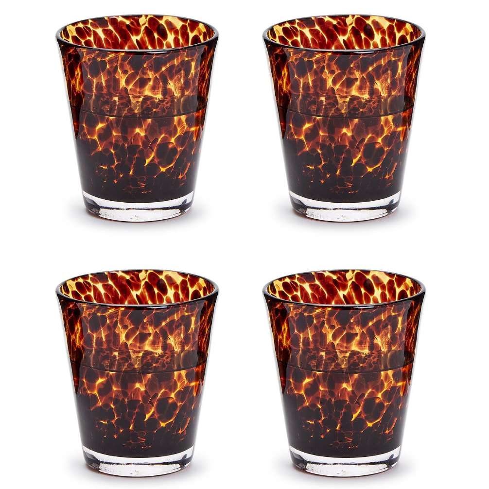 Four tortoiseshell patterned glasses on a white background