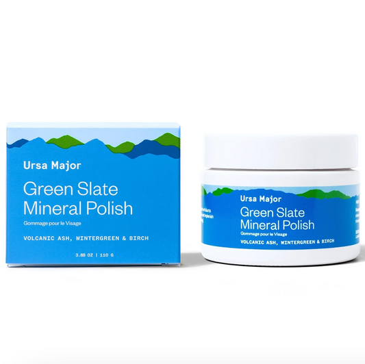 A jar of Green Slate Mineral Polish by Ursa Major, next to its packaging box. The box has a blue and green design with the text 'Ursa Major' and 'Green Slate Mineral Polish'.