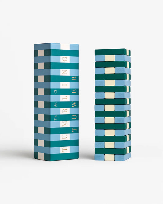 Stack of colorful blocks with a matching box on a white background